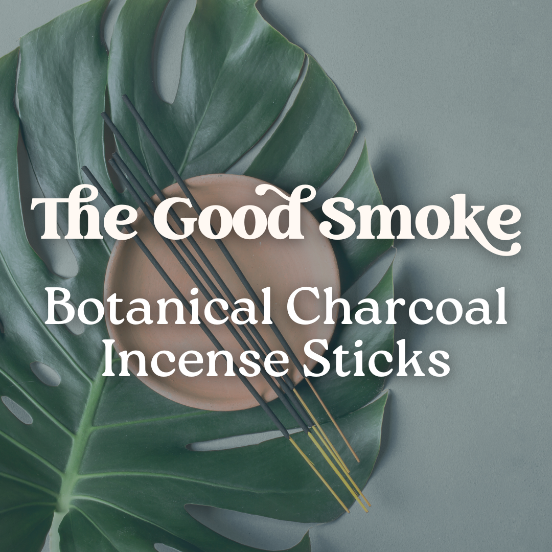 Botanical charcoal incense sticks on a leaf background