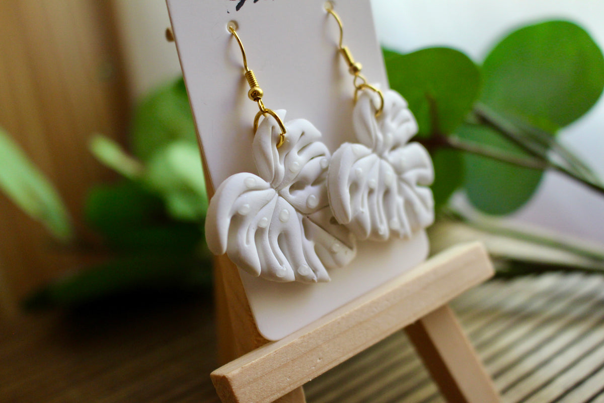 Monstera Dangle earrings shown on model