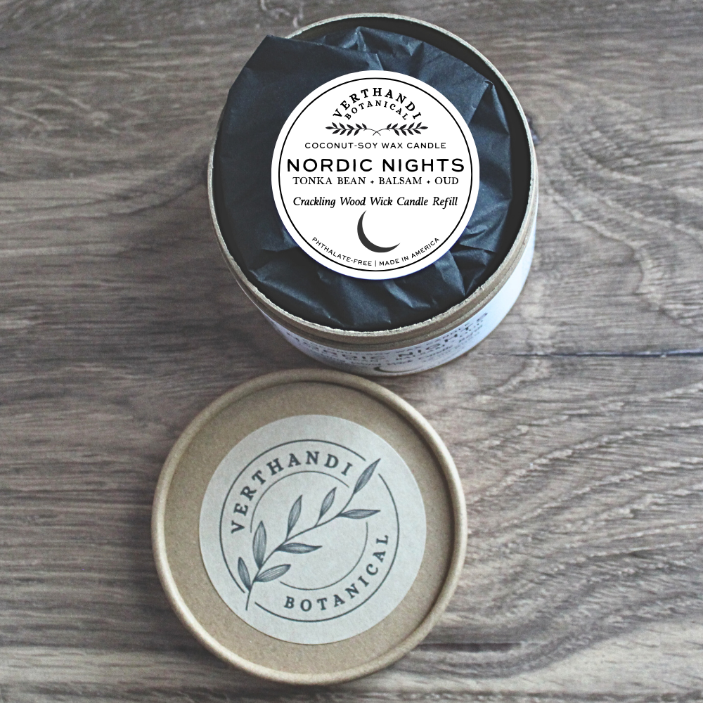 Verthandi Botanicals candle refill in a round container on a wooden surface