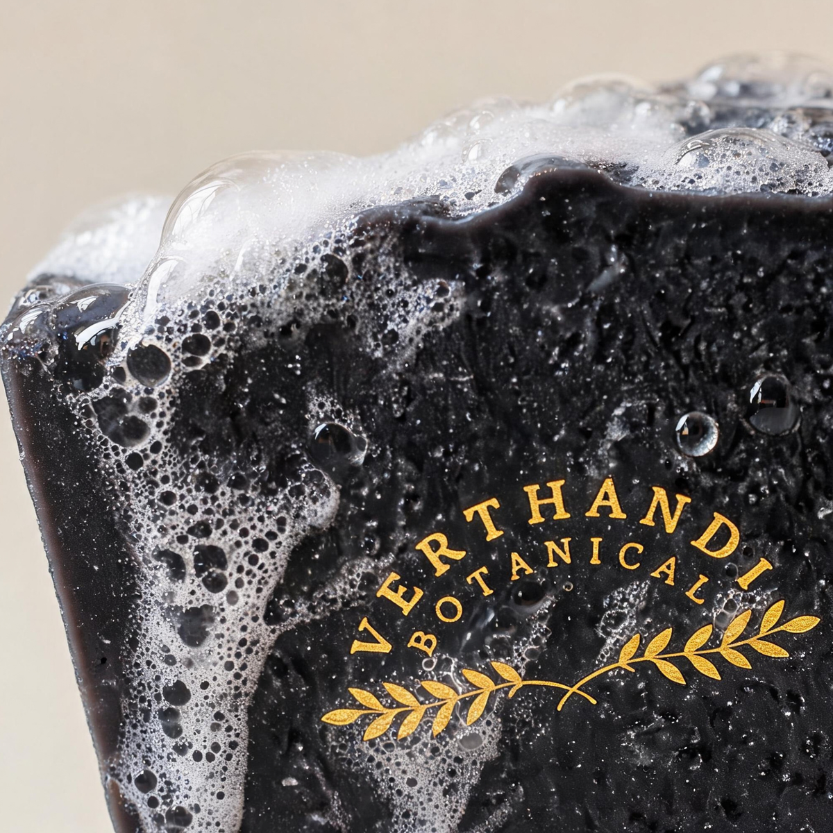 Detox Charcoal Natural Soap made with activated charcoal and scented with pure essential oils of tea tree and eucalyptus in suds