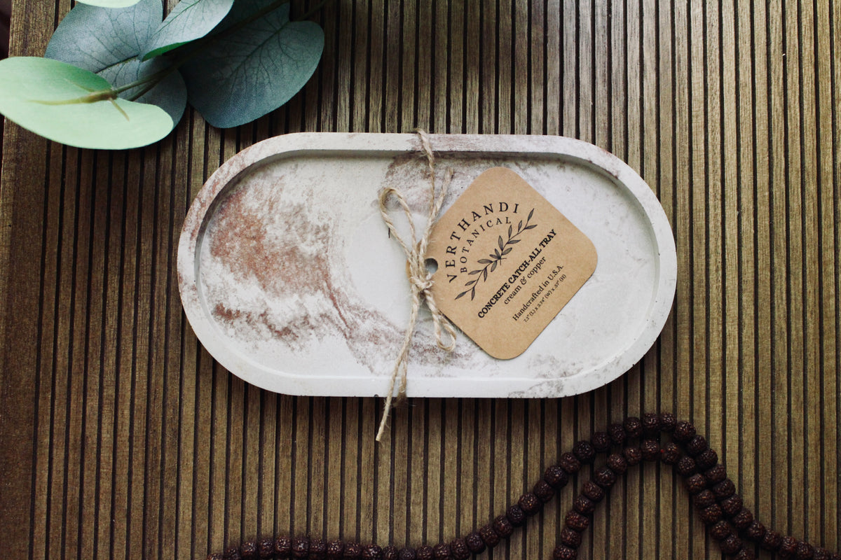 Concrete Oval Tray, close-up of the metallic rim detail
