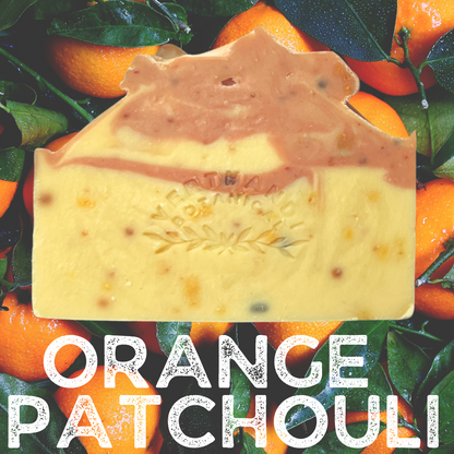 orange patchouli natural soap, front view with oranges background