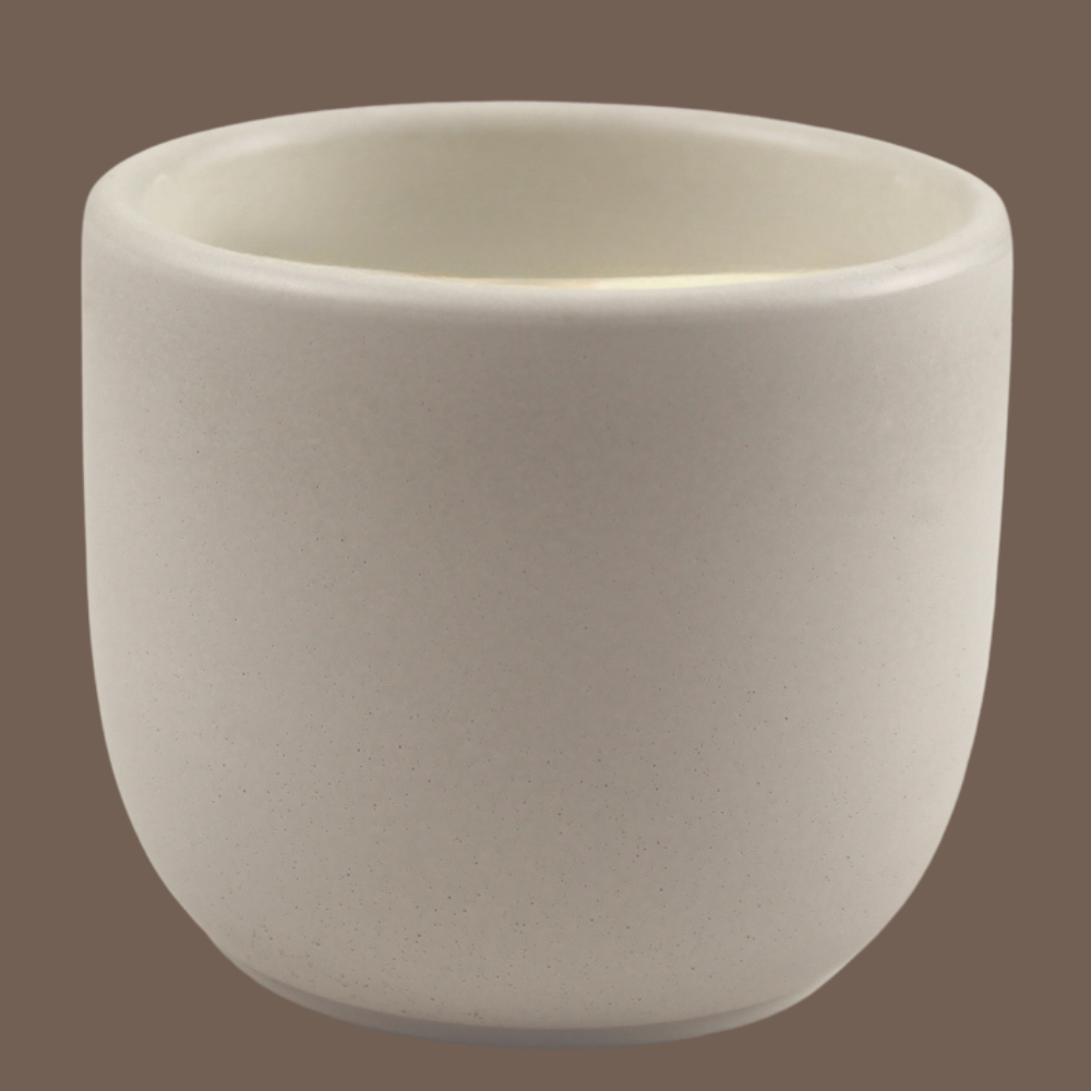 Empty cement jar for candle refills.