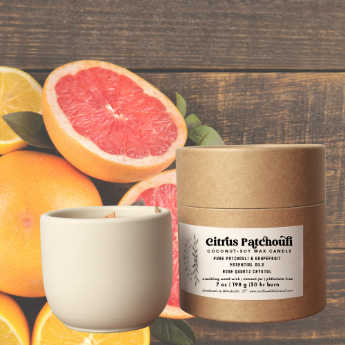 citrus patchouli essential oil candle with coconut soy wax, a crackling wood wick in a concrete jar with a crystal embed, side view of packaging