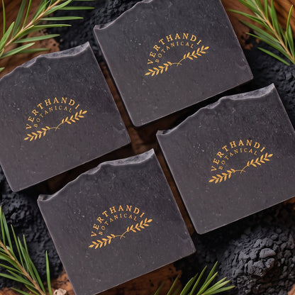 Detox Charcoal Natural Soap made with activated charcoal and scented with pure essential oils of tea tree and eucalyptus surrounded by activated bamboo charcoal