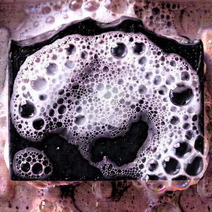 Detox Charcoal Natural Soap made with activated charcoal and scented with pure essential oils of tea tree and eucalyptus in suds