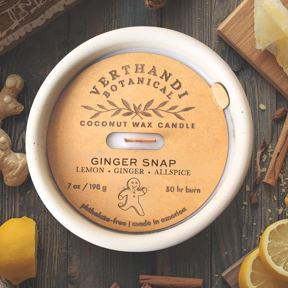 ginger snap scented candle with a crackling wood wick in concrete jar, top view of dust cover, lemon ginger scented candle