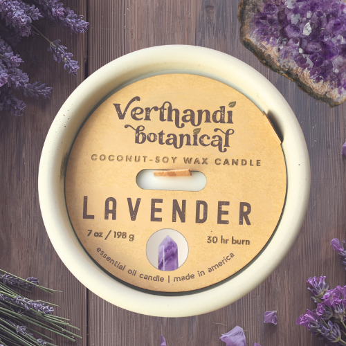 lavender essential oil candle with coconut soy wax, a crackling wood wick, in a concrete jar and a quartz crystal, top view of dust cover