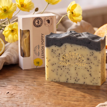 Lemon Poppy Natural Soap made with activated charcoal and scented with pure essential oils with packaging and yellow poppies