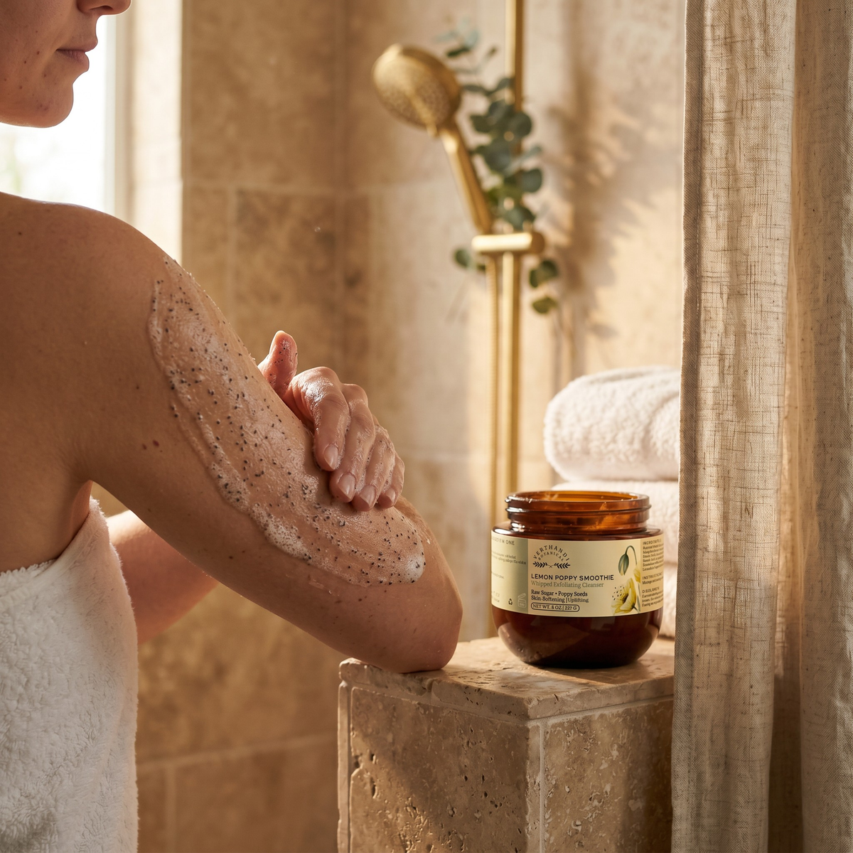 Lemon Poppy Sugar Scrub by Verthandi Botanical is a  Whipped exfoliating cleanser being applied to rough skin