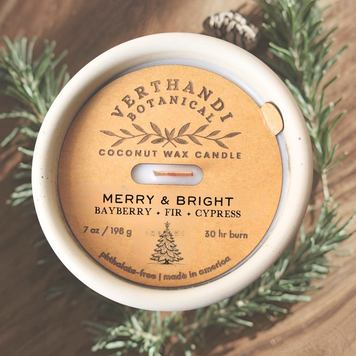 merry and bright scented candle with crackling wood wick in concrete jar, top view of dust cover, rosemary and sage scented candle