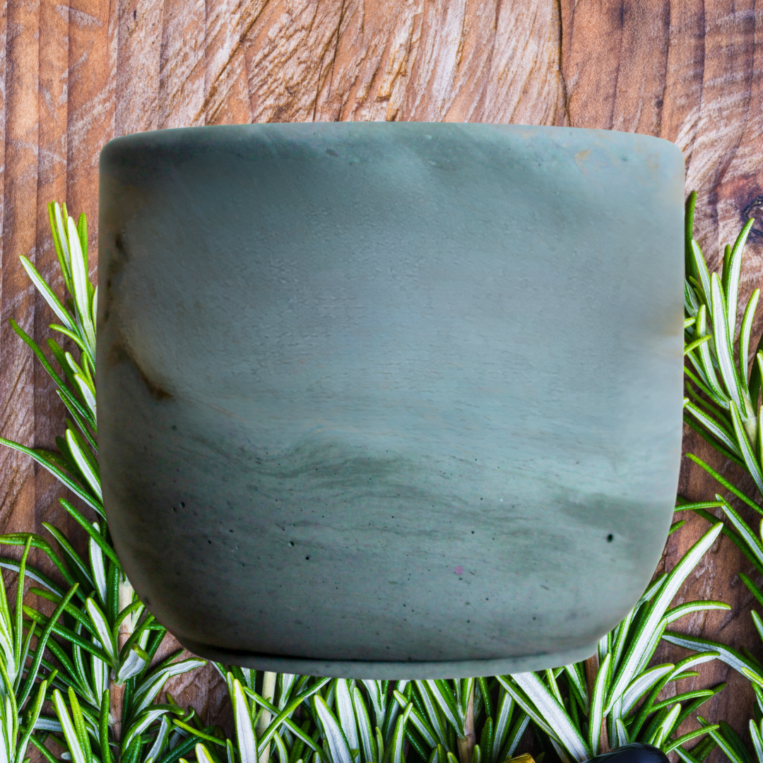 merry and bright coconut soy wax candle with crackling wood wick in concrete jar, in green concrete jar