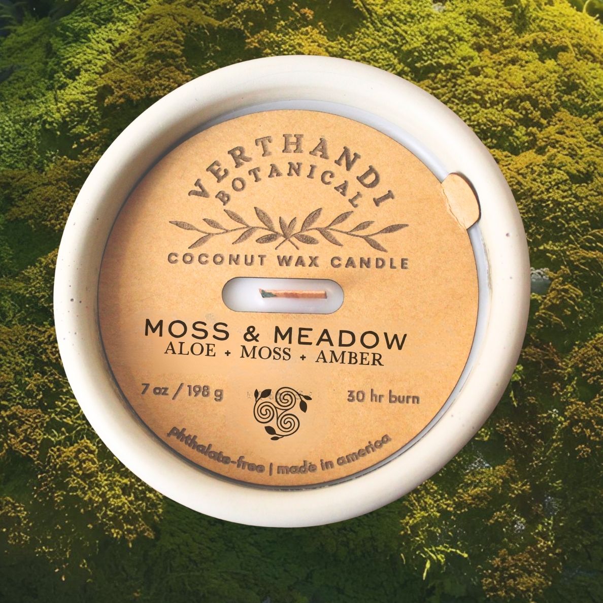 moss and meadow scented candle, coconut soy wax, wood wick, moss background, top view of dust cover