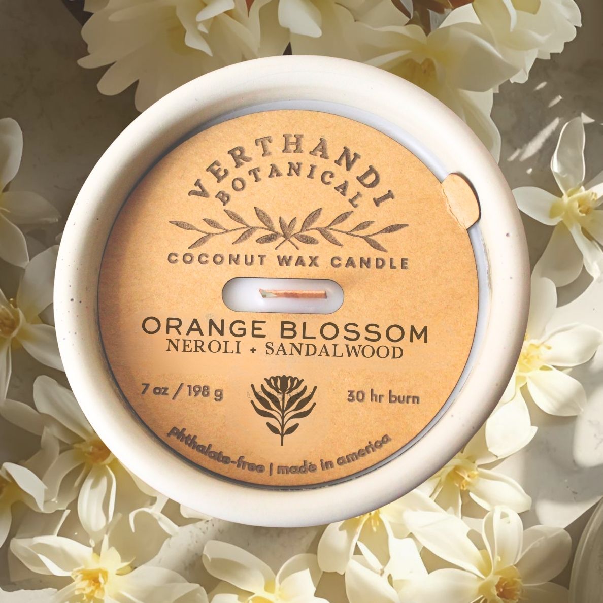 orange blossom scented candle with coconut soy wax and crackling wood wick in cement jar, top view dust cover
