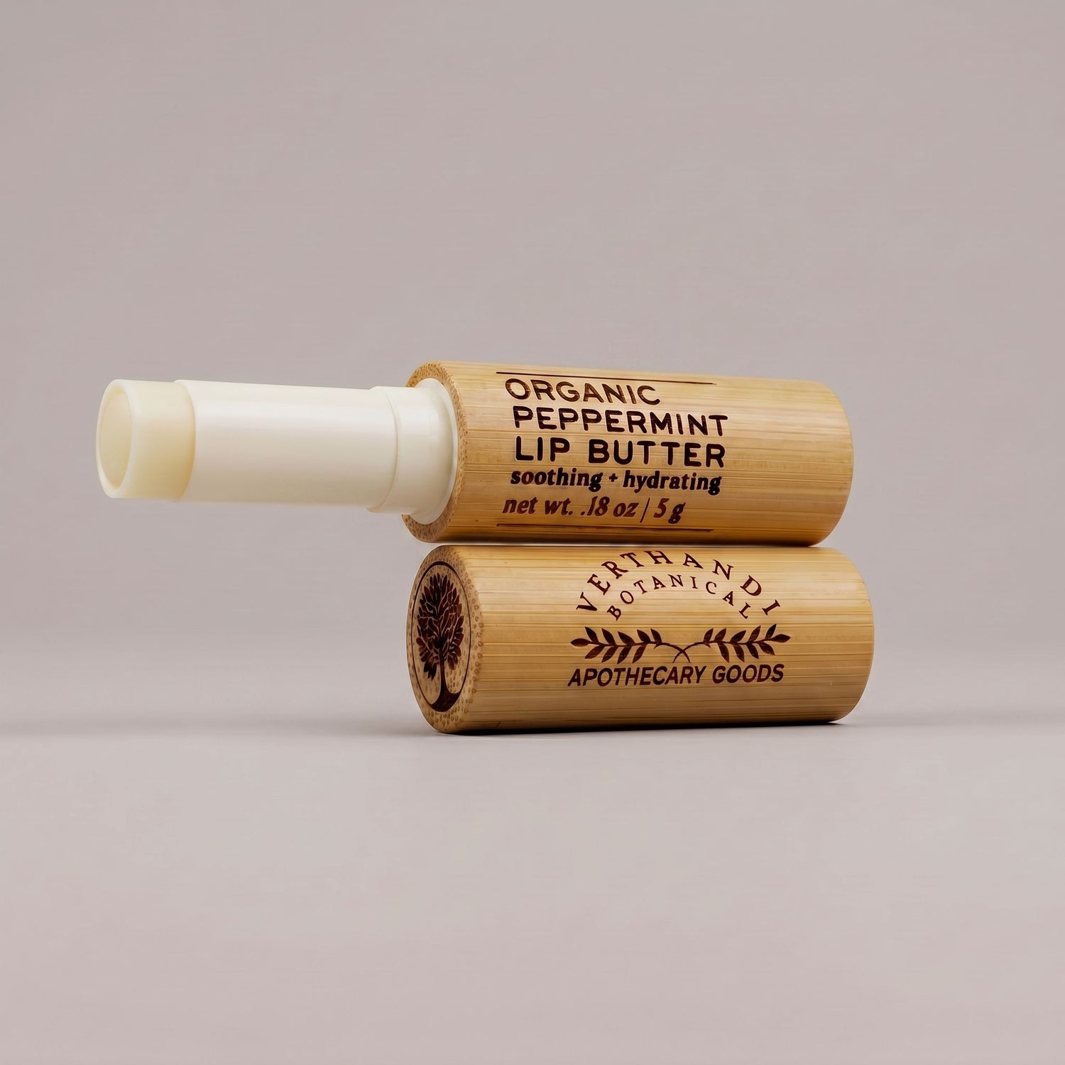 Organic Peppermint Lip Butter by Verthandi Botanical in a bamboo tube.