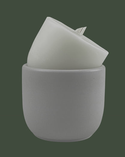 coconut wax candle refill with wood wick in a natural concrete jar with brand logo